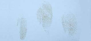 Fingerprints in blood on steel can with white coating.