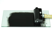 Glass inking slab 15x30 cm in use, shown here with 10 cm wide ink roller.