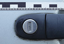 Magnetic ruler, 1 cm wide, 60 cm long on a car door.